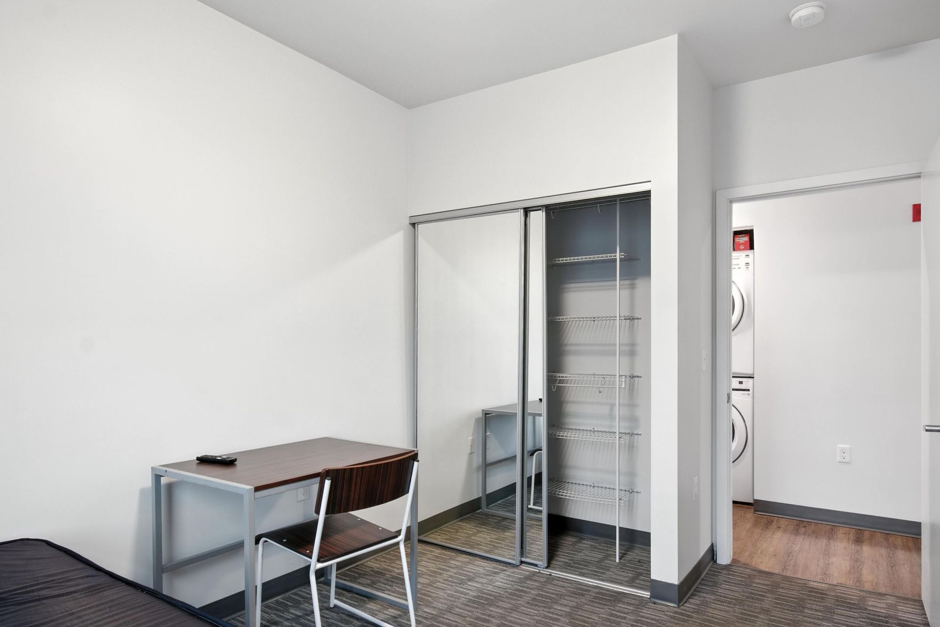desk near closet in bedroom