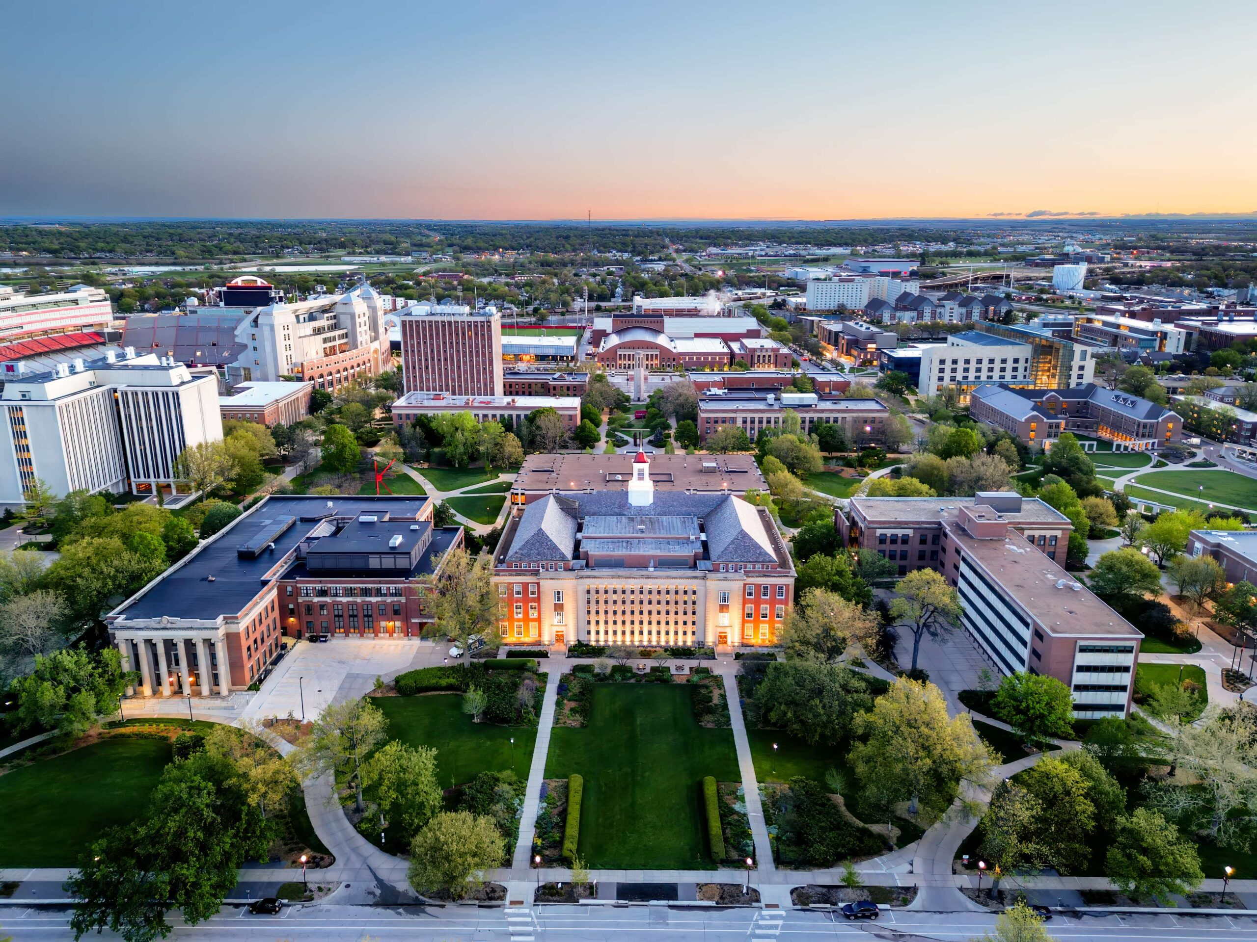 aerial university campus grounds at twilight scaled