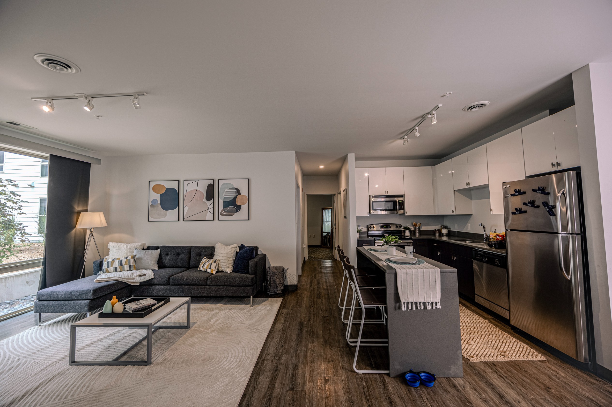 Kitchen and living room of a model apartment at Latitude Lincoln