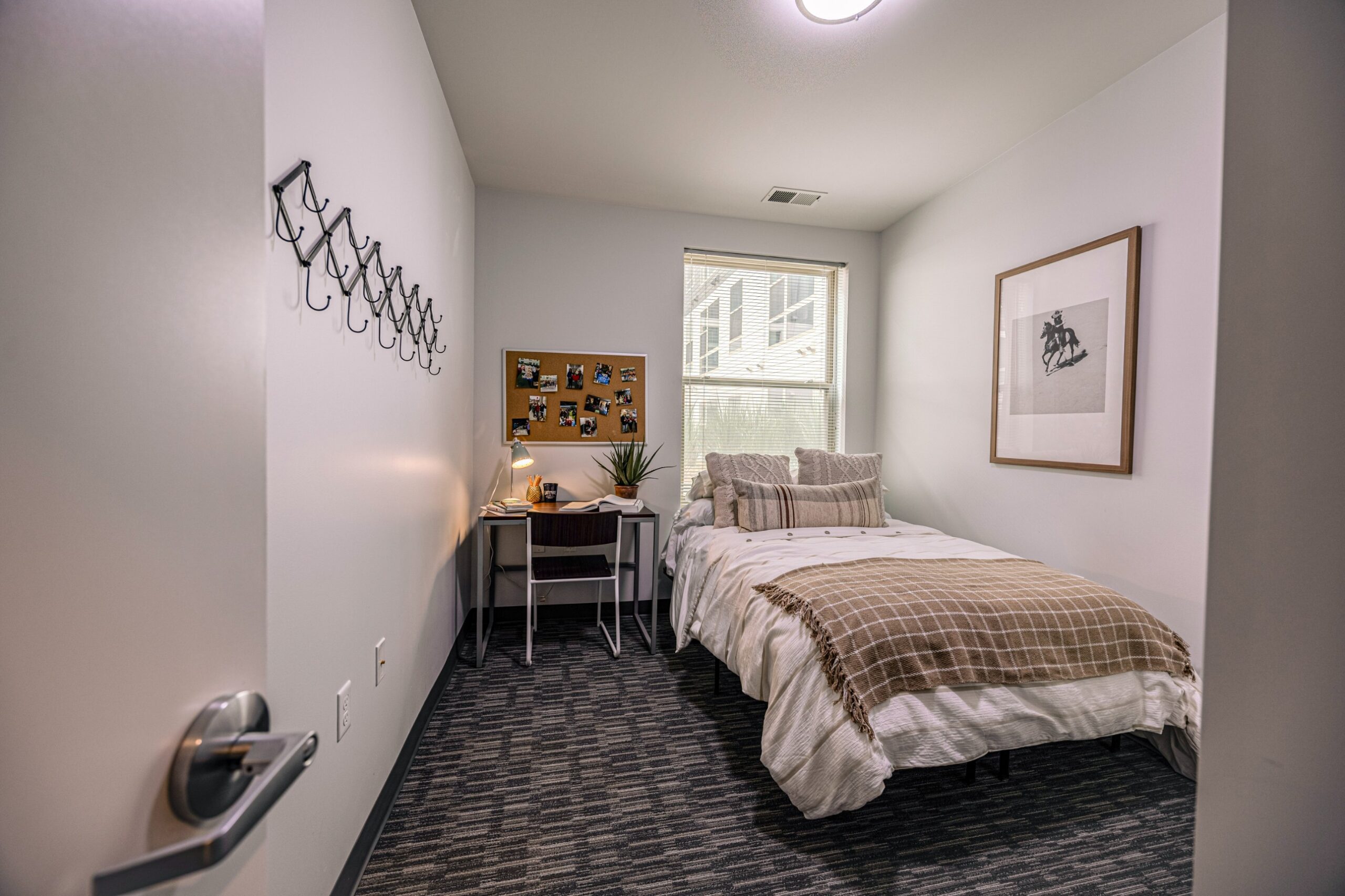Model bedroom with desk at Latitude Lincoln