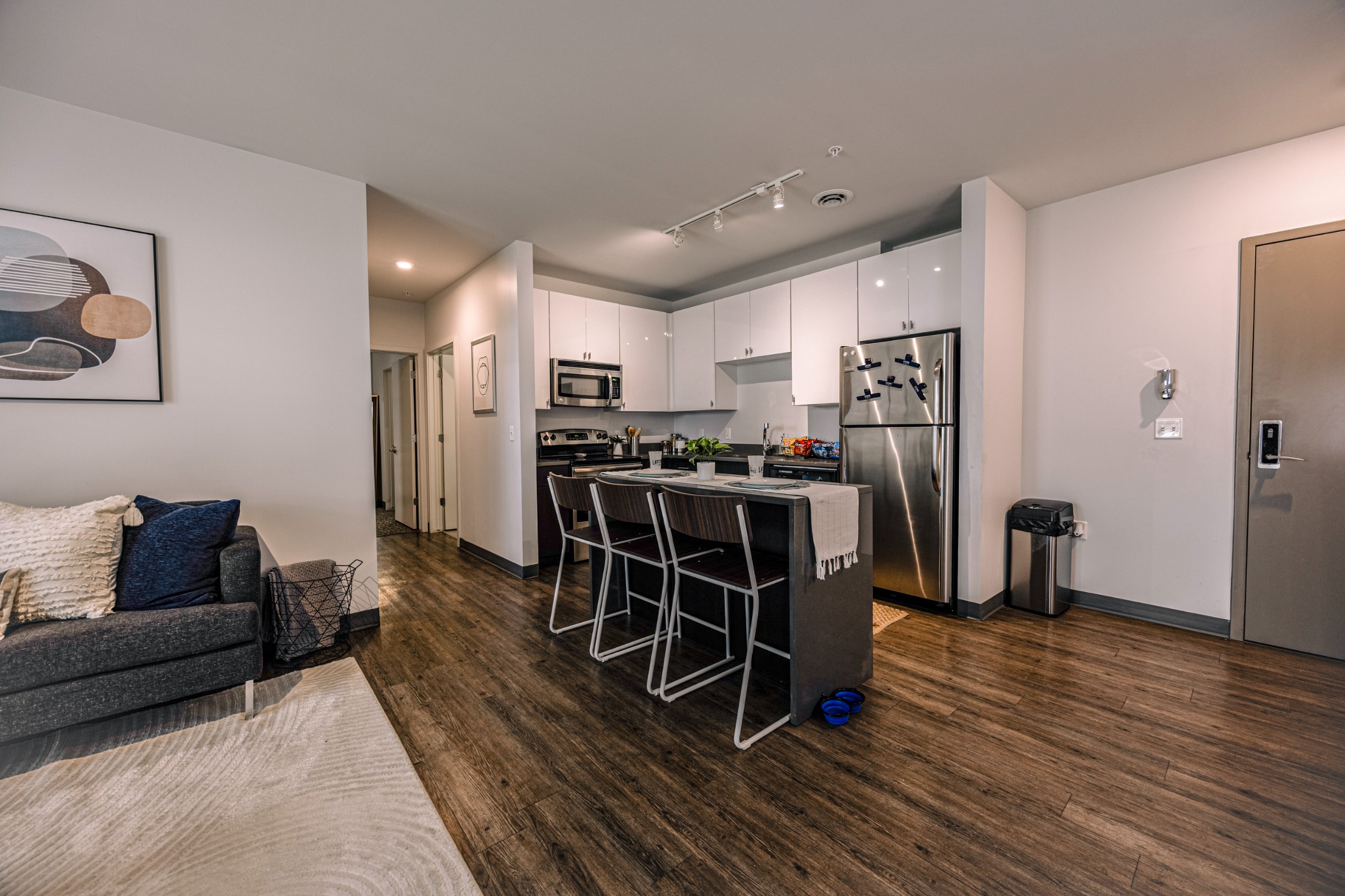 Model kitchen with island seating and stainless-steel appliances