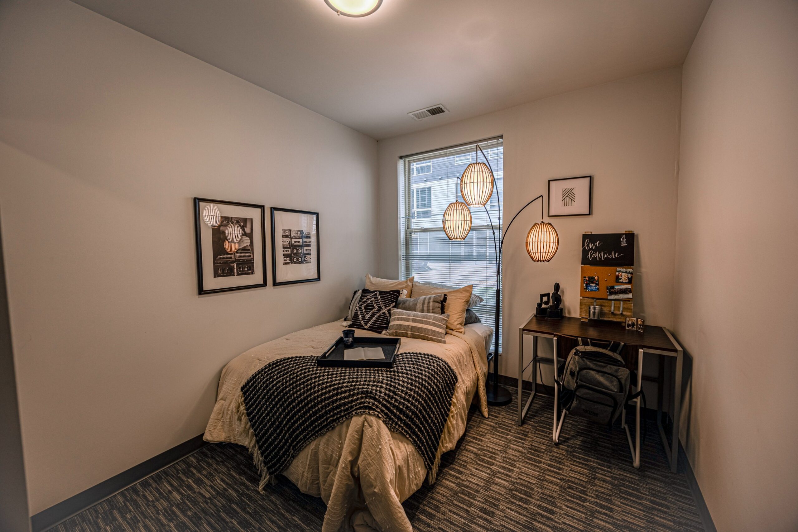 Model bedroom with desk and large window